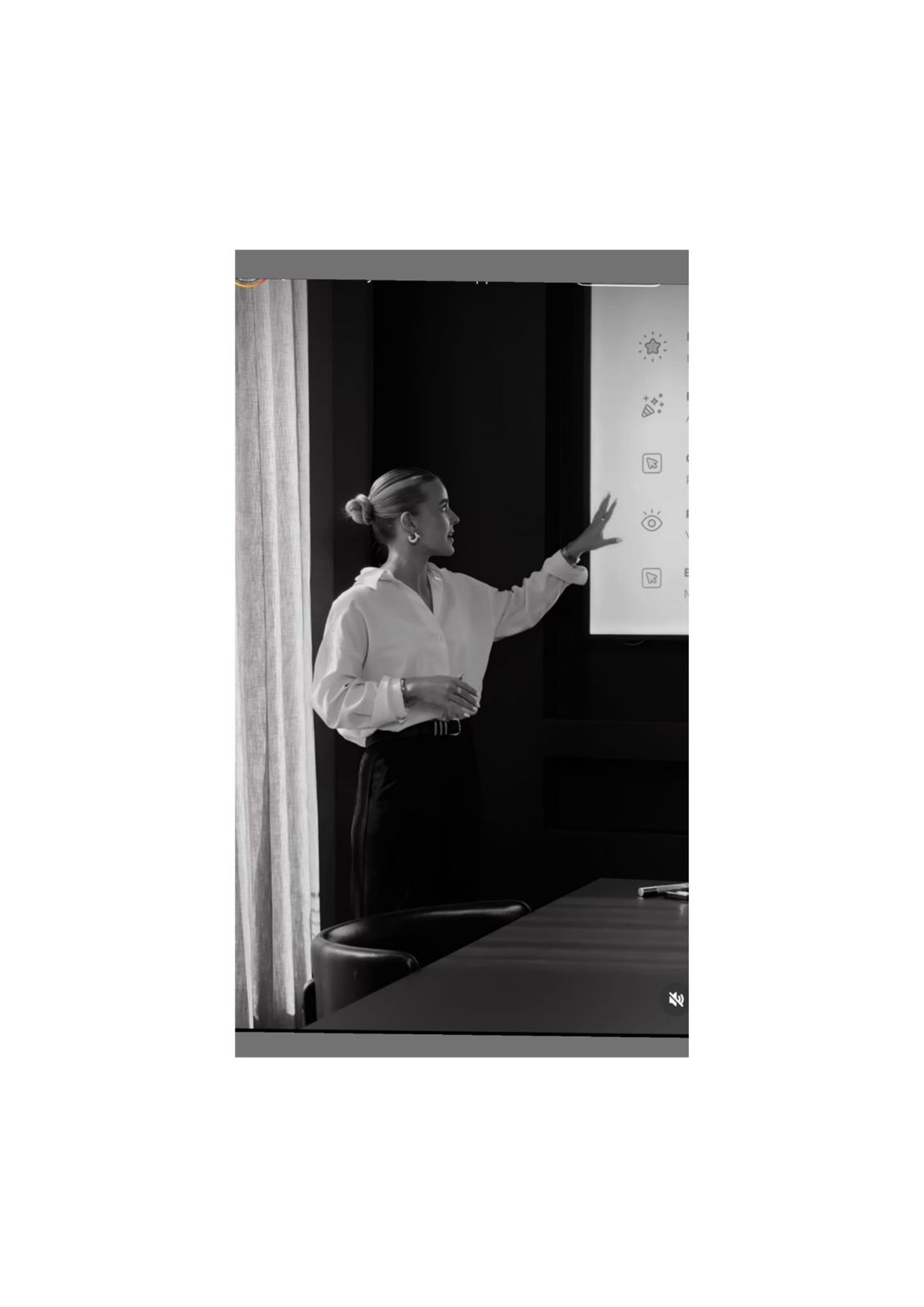 Woman presenting at a whiteboard in a leadership setting